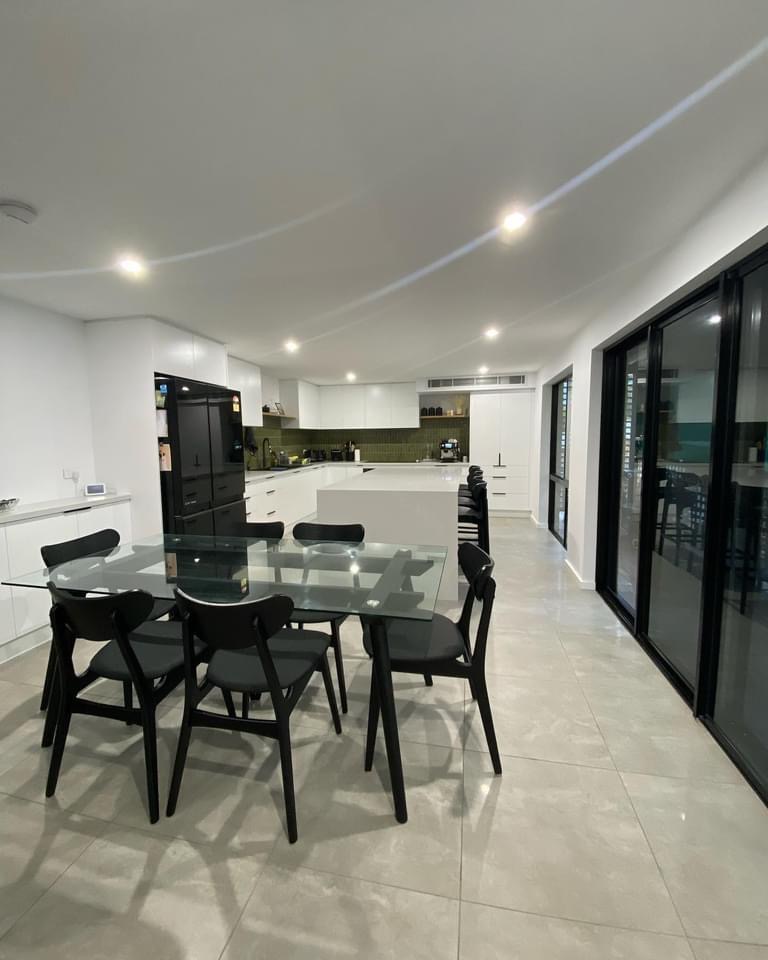 "Modern kitchen renovation featuring a large white island and custom cabinetry by MGB Joinery."