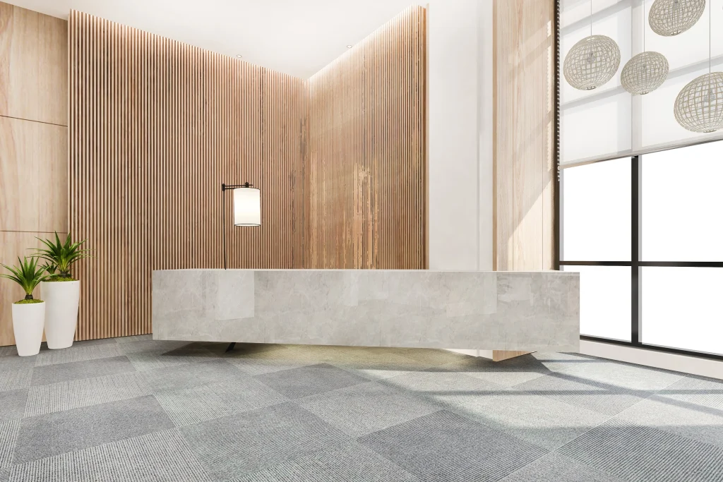 Modern office lobby in Sydney featuring custom joinery reception desk and built-in seating.