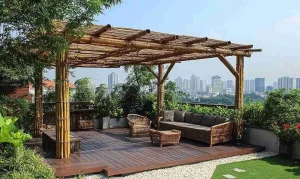 Beautiful bamboo pergola with a natural aesthetic, providing shade over a cozy outdoor seating area featuring wicker furniture, set on a wooden deck surrounded by lush greenery and a stunning city skyline view.